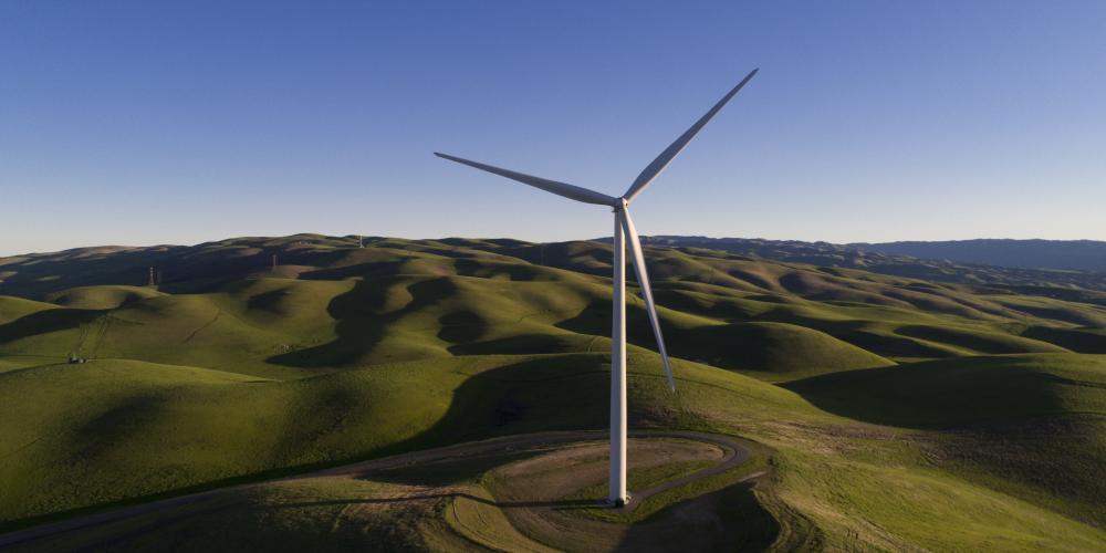 A windmill and the rolling hills of Alameda County.