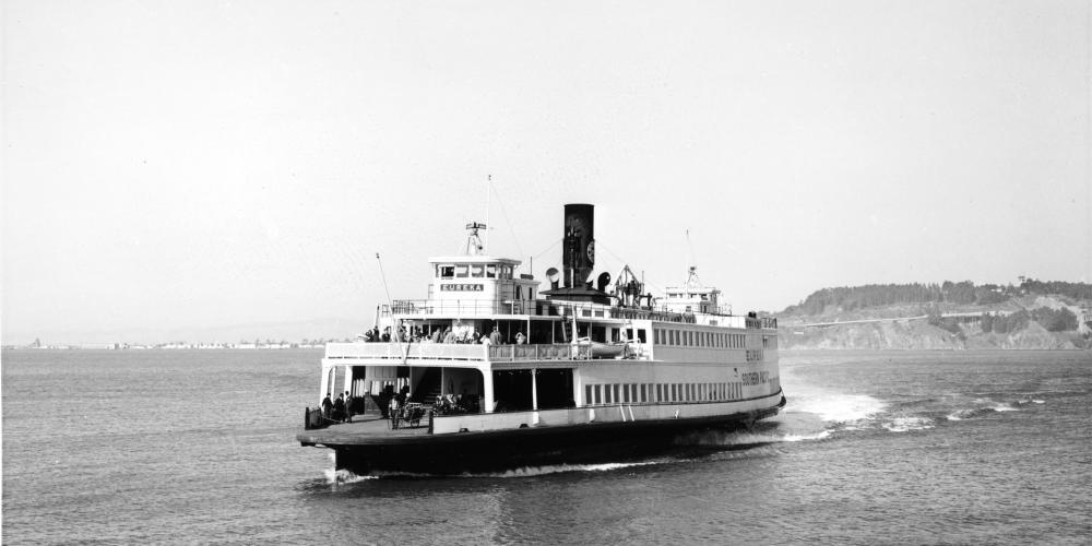 A vintage black and white photo of the Eureka ferryboat on the water, shown at an angle from the front-right-hand side.