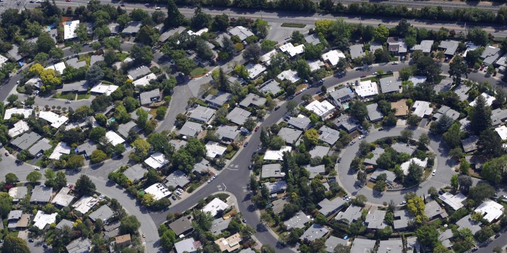 An aerial image of Foster City showing homes and trees.