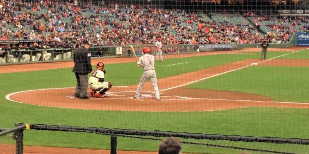at a giants game behind the batter