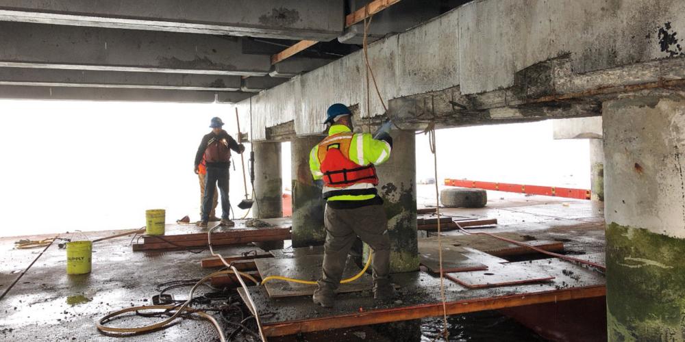 Workers making maintenance repairs on the San Mateo-Hayward Bridge.