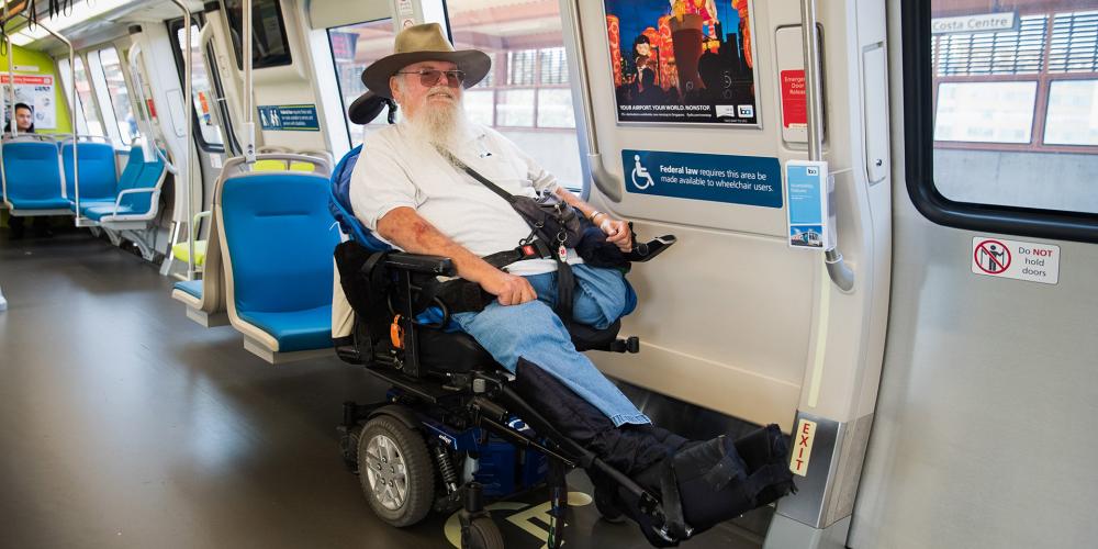 A wheelchair user on a BART train.