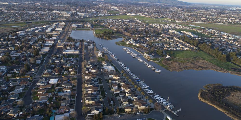 Aerial of housing developments, waterways and green space in Solano County.