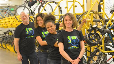 MTC staff in front of a bike rack