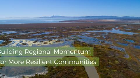 Text reads "Building Regional Momentum For More Resilient Communities" over a picture of bay wetlands.