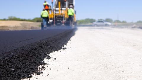 Paving a road.